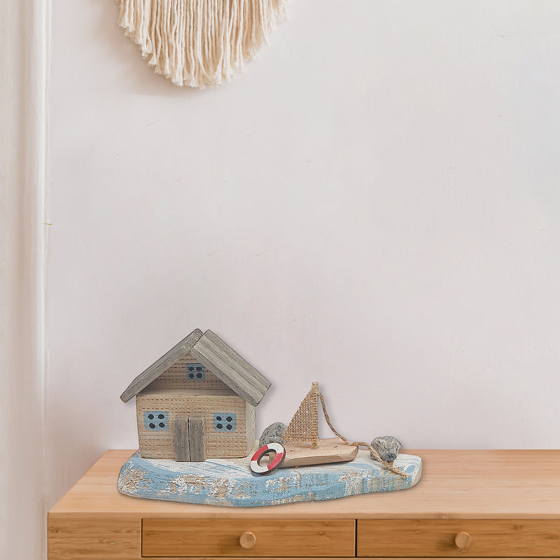 Wooden House & Sail Boat By The Sea Shore